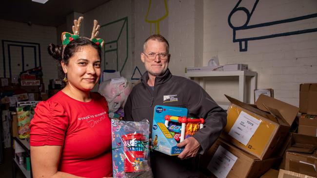 City Mission volunteer Diana Meza with Communications manager Brett Galbraith. Hobart City Mission are experiencing lower numbers of toy donations and are struggling to meet demand. Picture: Linda Higginson