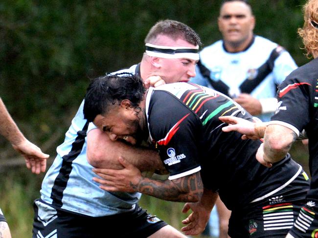 Jake Elphick being tackled by Mikaere Beattie. Group 2 Rugby League, 2025 round six. Sawtell Panthers v Woolgoolga Seahorses at Rex Hardaker Oval, June 1 2025. Picture: Leigh Jensen