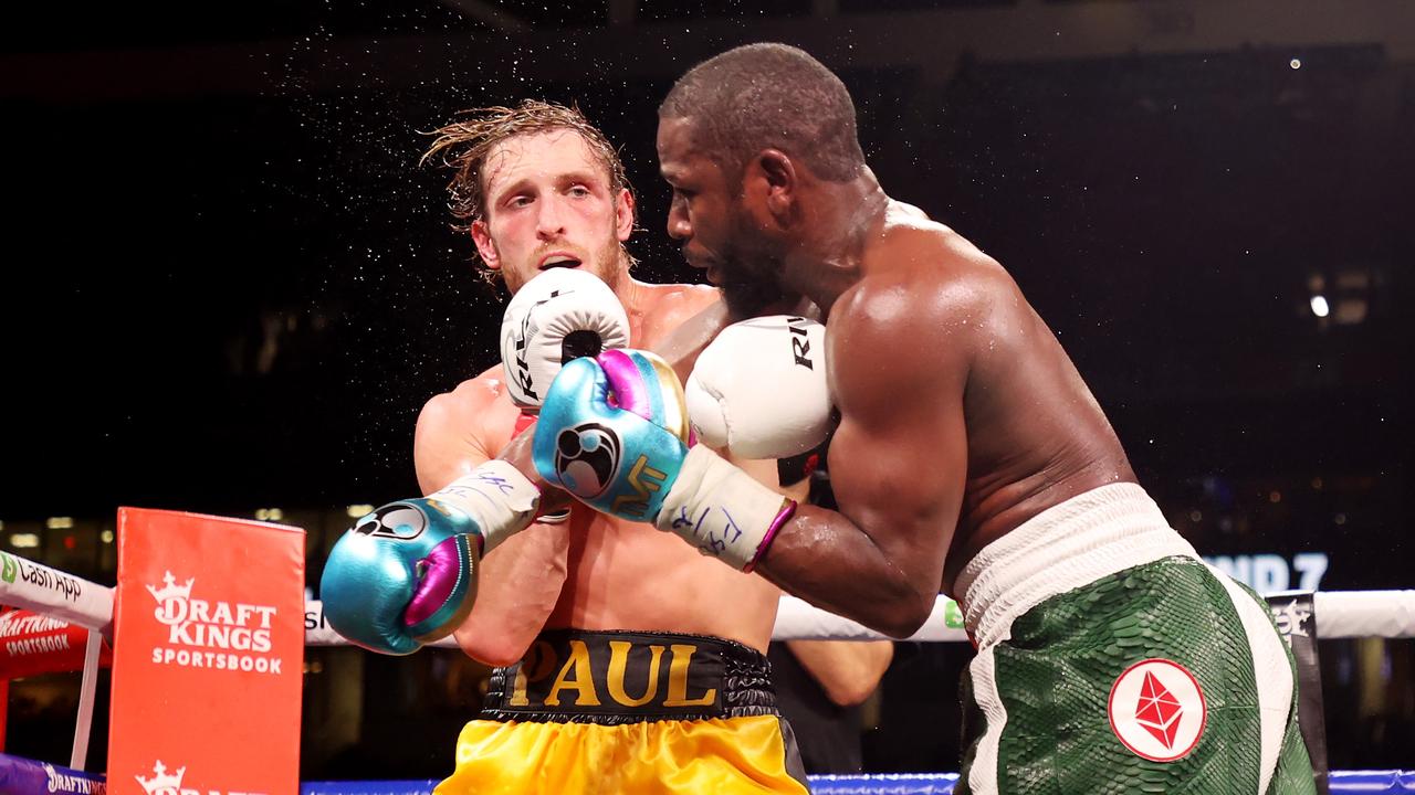 Floyd Mayweather exchanges blows with Logan Paul. Photo by Cliff Hawkins/Getty Images