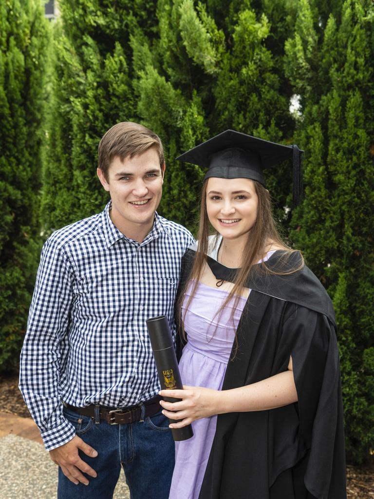 Jacob Luck with Bachelor of Business and Bachelor of Commerce graduate Katelyn Beresford at the UniSQ graduation ceremony at Empire Theatres, Tuesday, December 13, 2022. Picture: Kevin Farmer