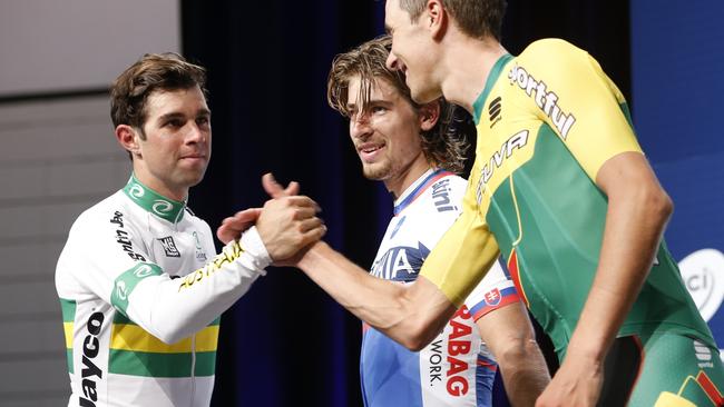 Michael Matthew is congratulated by bronze medallist Ramunas Navardauskas.