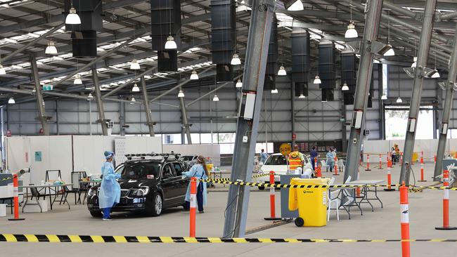 Testers at a drive-through centre at the Melbourne Showgrounds. Picture: NCA NewsWire/Ian Currie