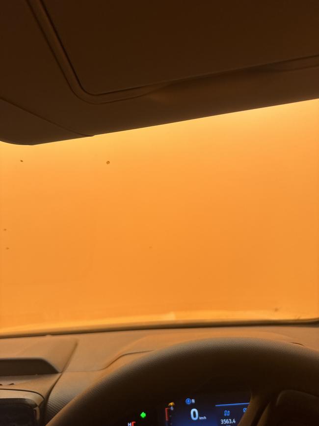 Advertiser journalist James Gratton and photographer Mark Brake get stuck in a wild dust storm. Picture: Supplied