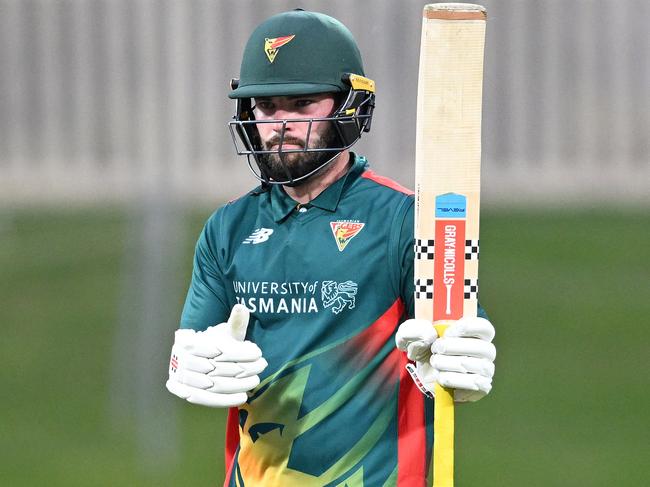 Caleb Jewell of Tasmania raises the bat after scoring a half century during the ODC match between Tasmania and Victoria at Blundstone Arena, on February 13, 2025, in Hobart, Australia. (Photo by Steve Bell/Getty Images)