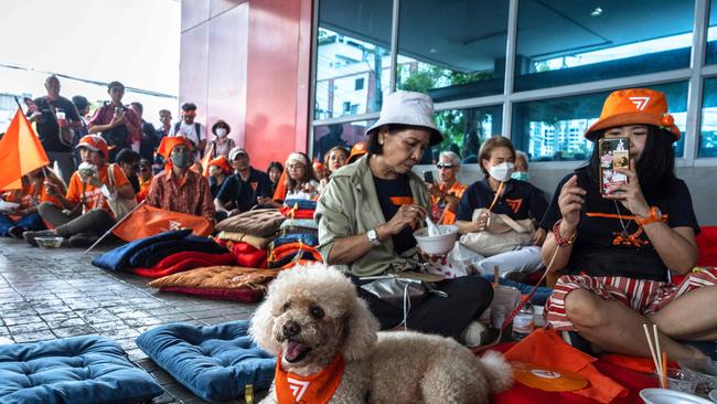 Supporters gather at the Move Forward Party headquarters in Bangkok ahead of the Constitutional Court’s ruling. Picture: AFP