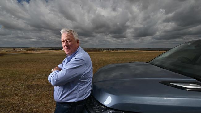 A frustrated John Wagner, holding site plans, on the area at his Wellcamp airport where he wanted to immediately build a Covid quarantine facility, at Toowoomba, west of Brisbane. Picture: Lyndon Mechielsen/ The Australian