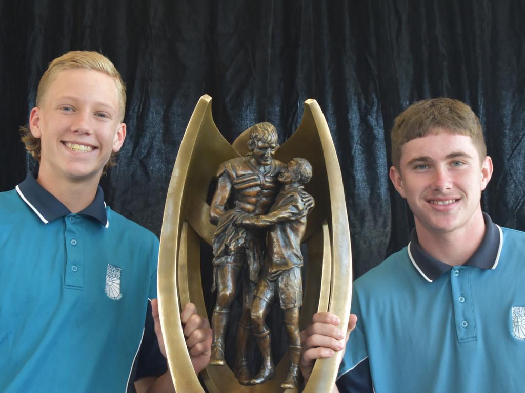 Jaxon Purdue (left) and Bailey Caruana with the NRL Provan-Summons Trophy at Mercy College, Mackay, September 16, 2021. Picture: Matthew Forrest