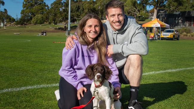 Dog walkers Maddie Johnson and Dante Di Domenico with their dog vogue at the million paws walk at Queens Domain in Hobart in Sunday 25th May 2025. Picture: Linda Higginson