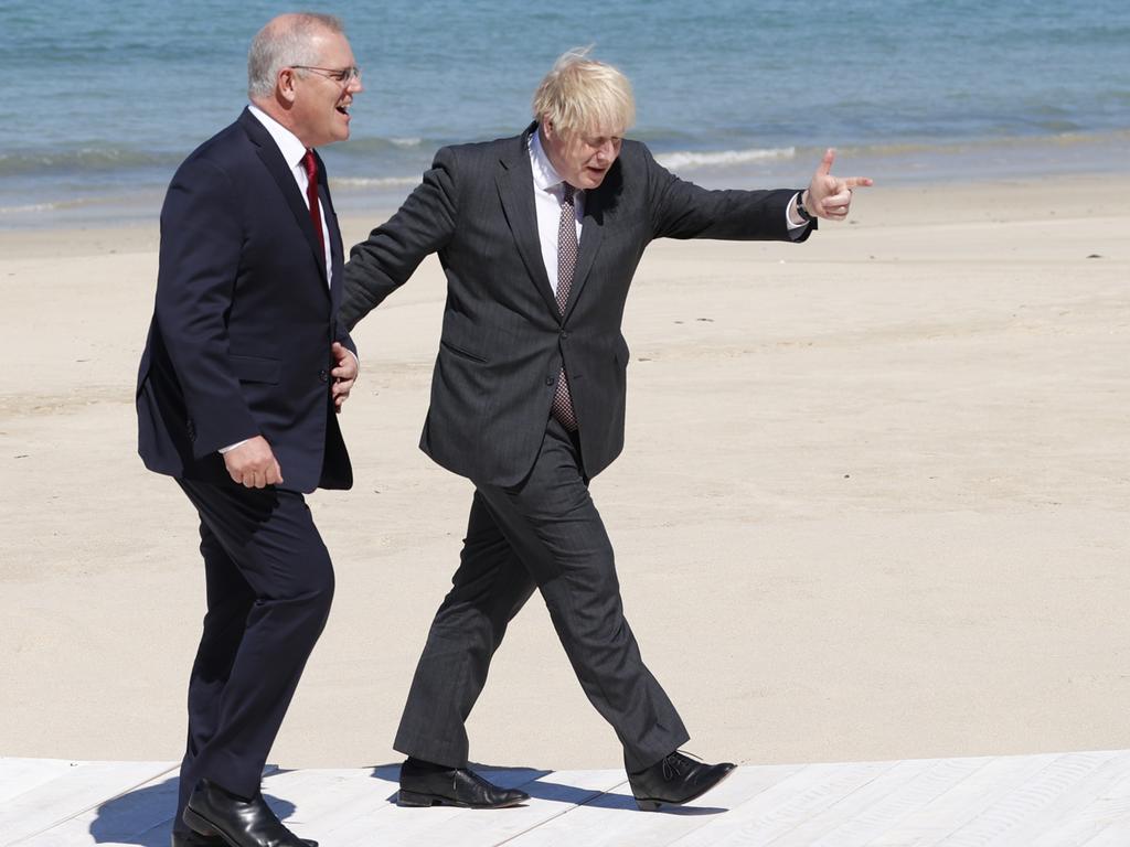 Britain's Prime Minister Boris Johnson has called for a ‘transparent’ investigation into the origins of Covid while PM Scott Morrison watches from the sidelines. Picture: Adrian Dennis-WPA Pool/Getty Images.