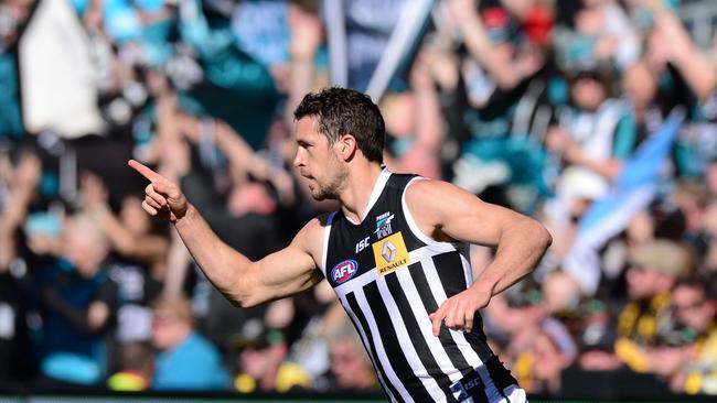 Travis Boak celebrates a goal wearing Port Adelaide’s prison bar guernsey against Richmond in 2014. Picture Mark Brake