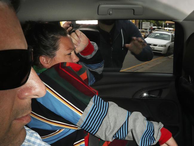 Former Kimberley College principal Paul Thompson's daughter Amy Ferguson being driven into the Brisbane watch house by police. Photographer: Liam Kidston.