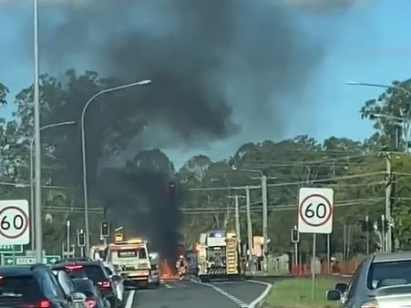 A van burst into flames producing plumes of smoke after a crash on a Logan Motorway on-ramp at Drews Road in Loganholme on Tuesday, April 4, 2023.Still from a video by Karlina Gil.