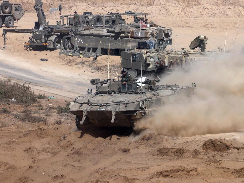 Israeli army armoured vehicles operate near the border with the Gaza Strip.