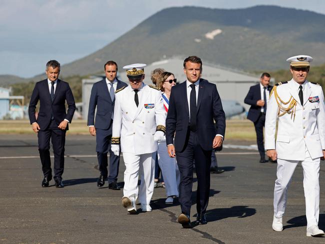 French President Emmanuel Macron walks alongside French High Commissioner to New Caledonia, Louis Le Franc upon arrival at Noumea. Picture: AFP