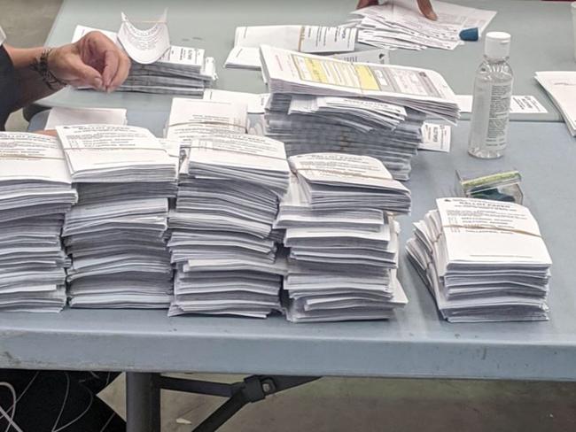 Electoral Commission of Queensland staffers begin the count in the Gold Coast City Council 2020 poll.