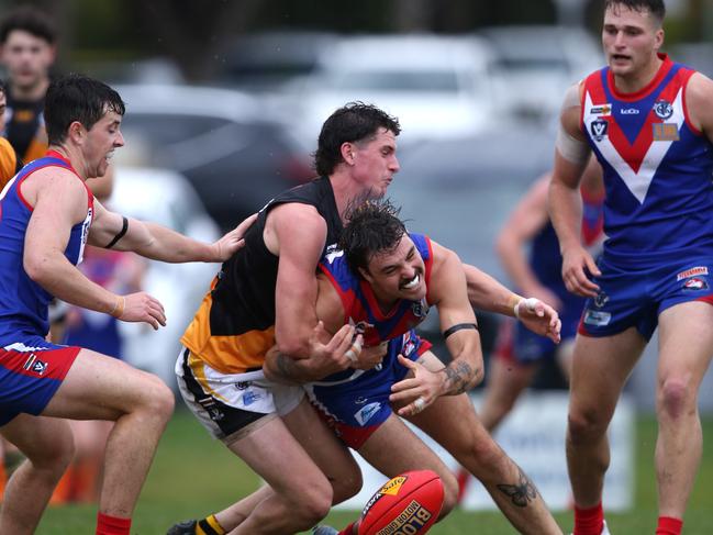 GFL Round 1: South Barwon v Grovedale. South Barwon's Zac Urquhart tackled strongly by Grovedale's Nicholas Hau. Picture: Mike Dugdale