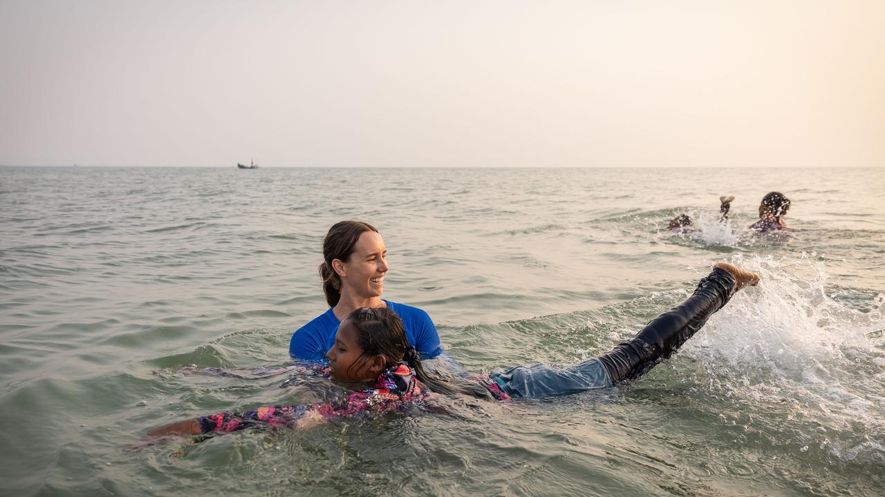 Swimmer Kayes, 11, with Olympian Emma McKeon. Picture: Jason Edwards