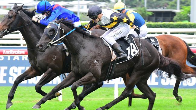 Jockey Vlad Duric powers Roll On High to victory in the Group 3 Fred Best Classic to secure a spot in the Stradbroke Handicap. Picture: Grant Peters - Trackside Photography