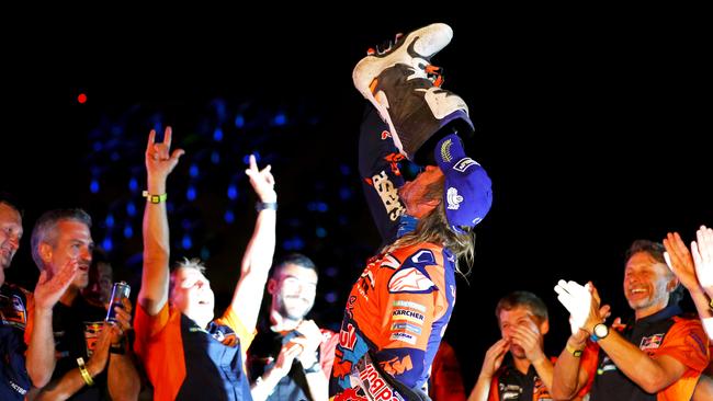 Toby Price celebrates third place on Dakar with a shoey on the podium.