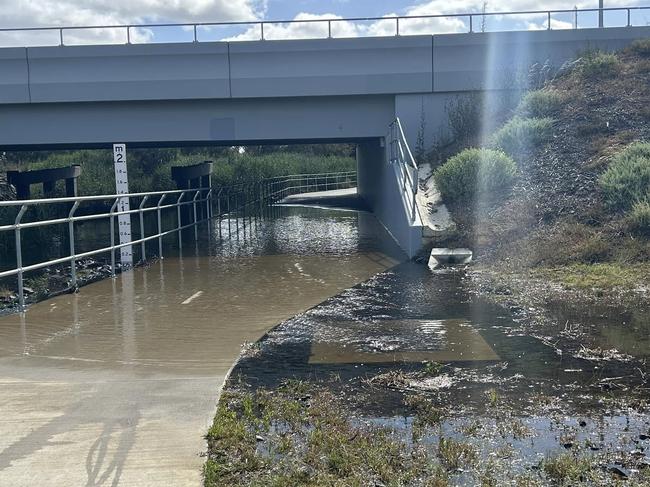 Shared path underneath Barwon Heads Road, alongside Waurn Ponds Creek floods after 10mm of rain in Geelong.