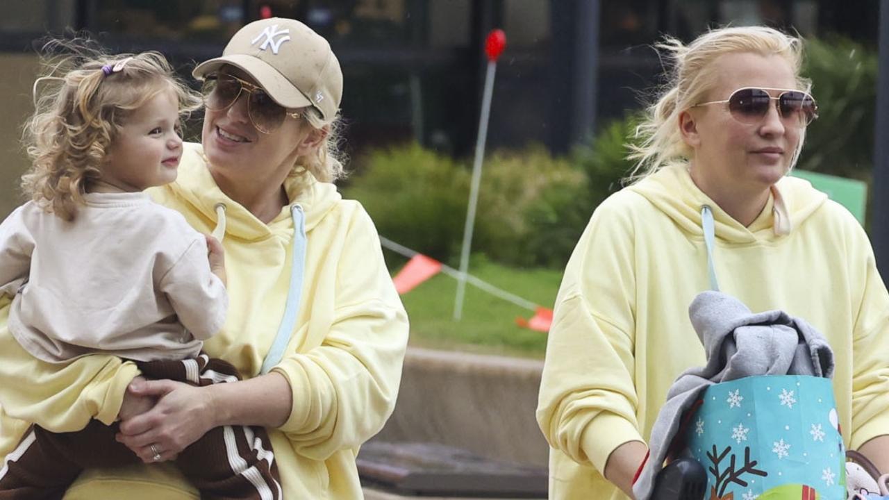 Rebel Wilson flies into Sydney with wife and daughter