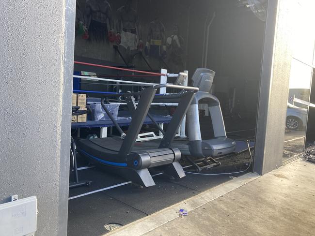 Damaged gym equipment could be seen inside the building.