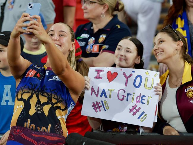 GOLD COAST, AUSTRALIA - OCTOBER 14: Natalie Grider of the Lions interacts with fans after the 2023 AFLW Round 07 match between the Gold Coast SUNS and the Brisbane Lions at Heritage Bank Stadium on October 14, 2023 in Gold Coast, Australia. (Photo by Russell Freeman/AFL Photos via Getty Images)