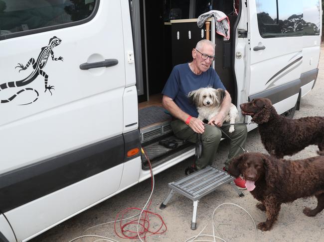 Bob Bramwell from Beaufort camped at the Wendouree relief centre with his dogs Alfie, Jacks, and Lilly. Picture: David Crosling