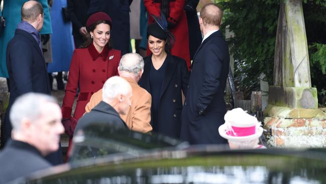 And the most important fashion battle of all — whose bald patch is balder? Picture: AFP 