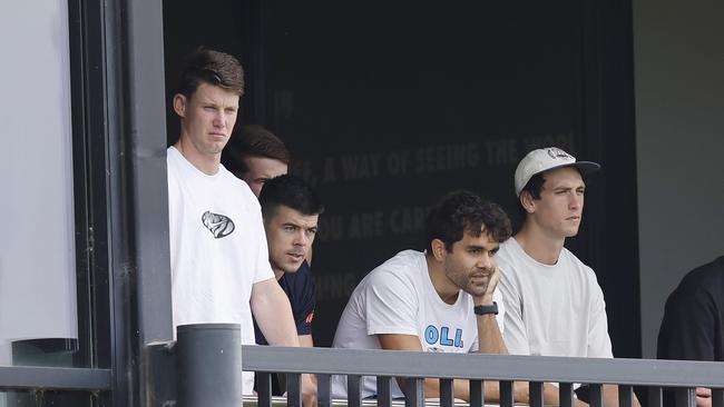 An injured Sam Walsh of the Blues watches from the balcony with teammates at Ikon Park. Picture: Michael Klein