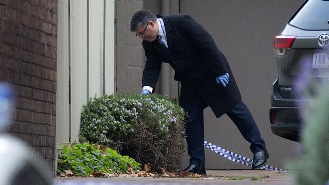 Homicide detectives search a property after a 26-year-old woman’s body was found. Picture: Sarah Matray