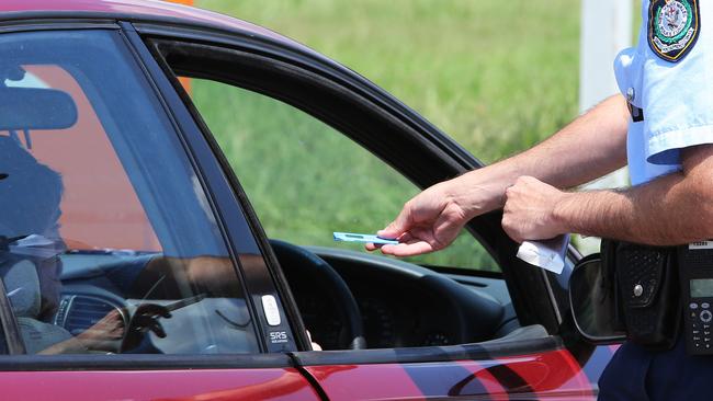 A police officer administering a drug test.