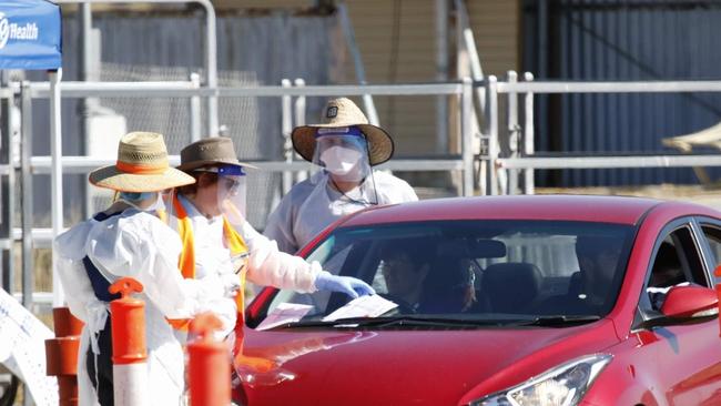 National Cabinet is expected to approve a massive coronavirus testing blitz. Here people are being tested in their cars at Blackwater. Picture: Steve Vit