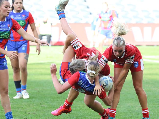 Ella Koster with a crunching tackle. Picture: Warren Gannon Photography