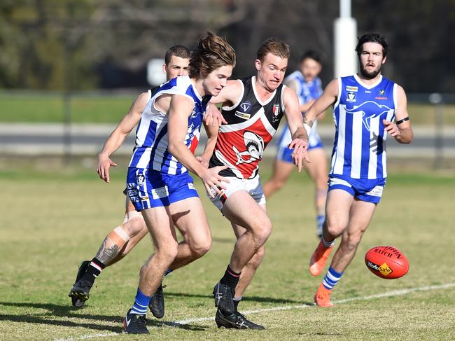 Peninsula FL: Langwarrin v Bonbeach at Lloyd Park. Langwarrin #17 Dale Binks and Bonbeach #6 James Murnane battle for possession.  Picture: Chris Eastman