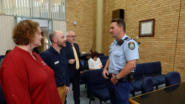 Kym Watson from Caffine Central and Shannon Johnson store manager Woolworths discuss crime with Senior Constable Daniel Dunn during a forum at the Council chambers in 2018. Photo: Trevor Veale