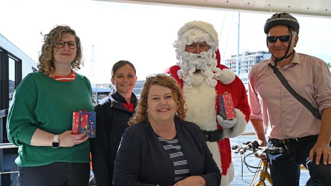 Hobart Lord Mayor Anna Reynolds with Children's Mayor Lola Mennitz, commuters Naomi Duke and Christian Narkowicz, and Santa on the ferry at Brooke Street Pier. Picture: John Sampson