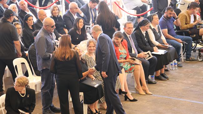 Labor leader Anthony Albanese shakes the hand of Jenny Morrison, wife of Prime Minister Scott Morrison. Picture: Toby Zerna