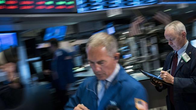 Traders at the New York Stock Exchange as the Dow sheds 250 points