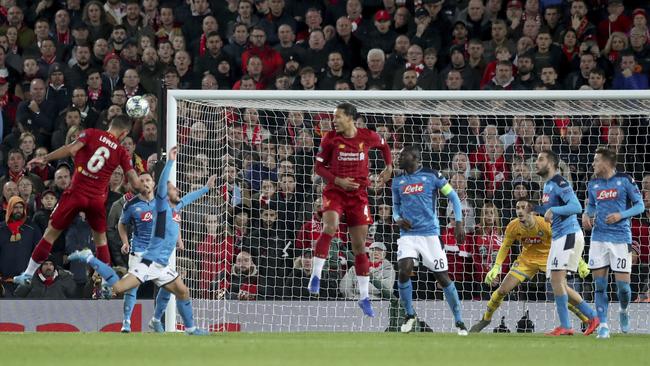 Liverpool’s Dejan Lovren, left, scores with a header against Napoli at Anfield in the Champions League group match. Picture: AP