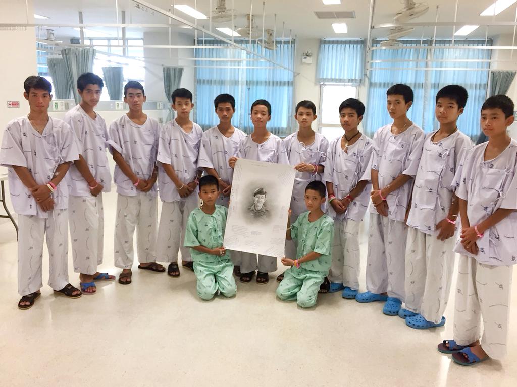 This handout photo released by the Ministry of Health, Chiang Rai Prachanukroh Hospital on July 15, 2018 and taken on July 14 shows members of the rescued 