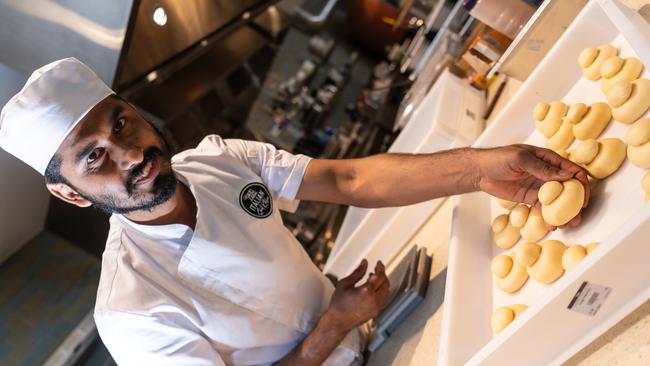 Anjan Adhikari prepares some delicious dessert buns. Picture: Monique Harmer