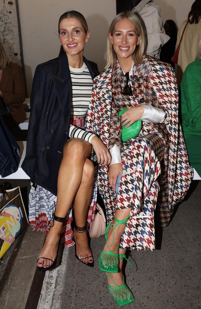 Phoebe Burgess (right), pictured with socialite Kate Waterhouse, rocked not one but two outfits, starting with this ensemble at the start of the day. Picture: Caroline McCredie/Getty Images