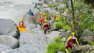 Members of the Queensland Fire and Emergency Services Swiftwater Unit from Cairns worked in the multi-agency search for a woman who went missing after being swept away at Mossman Gorge in Far North Queensland. Picture: Supplied