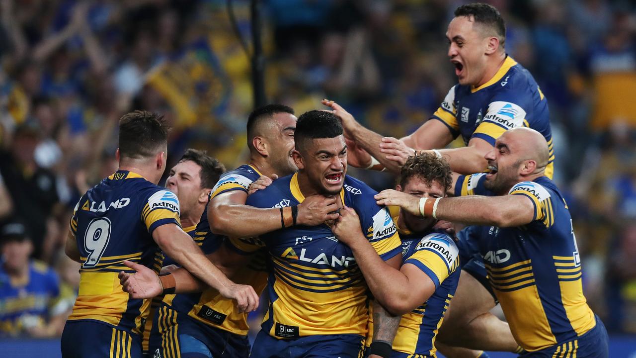 Parramatta players celebrate a try by 's Oregon Kaufusi