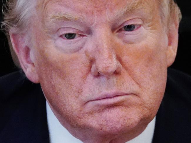 US President Donald Trump speaks during a meeting with industry executives in the State Dining Room of the White House on the plan for "Opening Up America Again," on April 29, 2020, in Washington, DC. (Photo by MANDEL NGAN / AFP)