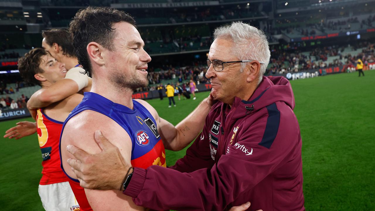 MELBOURNE, AUSTRALIA - APRIL 11: Lachie Neale of the Lions is congratulated after his 250th match by Chris Fagan, Senior Coach of the Lions during the 2024 AFL Round 05 match between the Melbourne Demons and the Brisbane Lions at the Melbourne Cricket Ground on April 11, 2024 in Melbourne, Australia. (Photo by Michael Willson/AFL Photos via Getty Images)