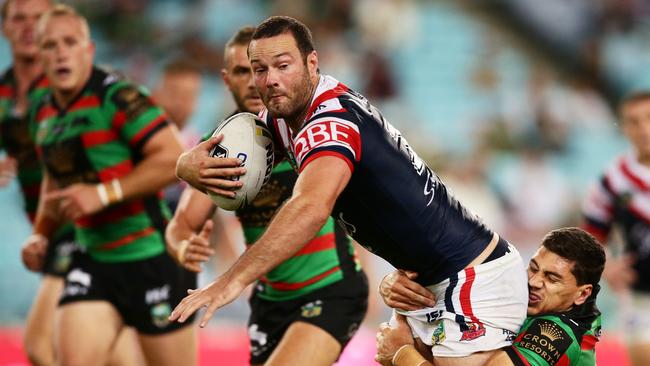 SYDNEY, AUSTRALIA — MARCH 23: Boyd Cordner of the Roosters is tackled during the round four NRL match between the South Sydney Rabbitohs and the Sydney Roosters at ANZ Stadium on March 23, 2017 in Sydney, Australia. (Photo by Matt King/Getty Images)