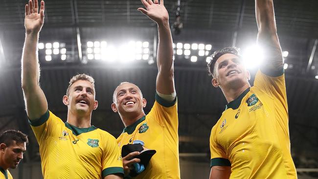 SAPPORO, JAPAN - SEPTEMBER 21: (L to R) Nicholas White, Christian Lealiifano and Matt To'omua of Australia wave after the Rugby World Cup 2019 Group D game between Australia and Fiji at Sapporo Dome on September 21, 2019 in Sapporo, Hokkaido, Japan. (Photo by Dan Mullan/Getty Images)