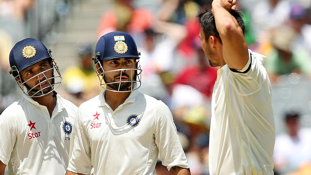 Virat Kohli and Mitchell Johnson exchange words during the MCG Test in 2014.